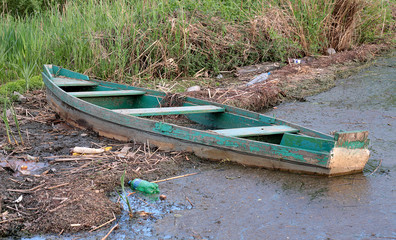 abandoned boat polluted river