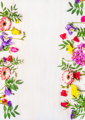 Frame of spring flowers, a variety of colors, space for text, card for the holiday