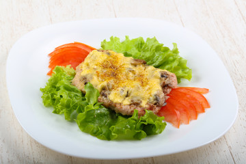 Pork steak with mushroom and cheese
