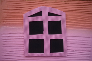 Small children play house window.