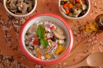 Bowl with rice salad and vegetarian toppings