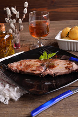 Serving of tuna fish on a black plate