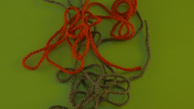 Someone is Pulling Tangled Yarn on Green Screen Colorful Filament Fiber Clue Funiculus Threads Are Moving Red Thread is Removed Wool Thread is Moving Slowly