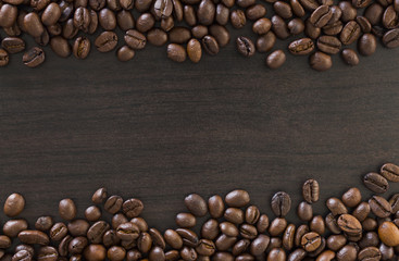 roasted coffee beans on wooden background