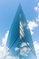 Fototapeta na wymiar modern glass building skyscraper blue sky