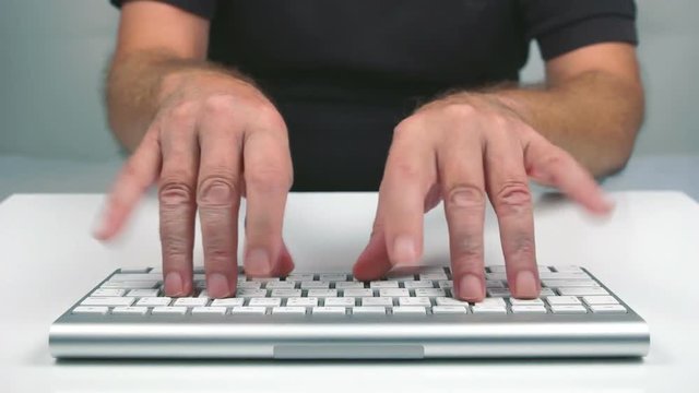 Fast typing on a keyboard in a traditional comical way.