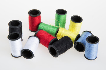 Multicolored thread on a white background