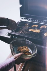 Grilled chicken on the gas grill on the garden, white background