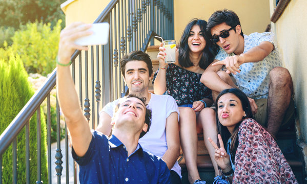 Young Happy People Taking A Selfie With Smartphone