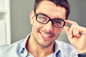 portrait of businessman in eyeglasses at office