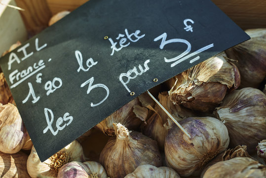 Fresh garlic on French market stall, close-up