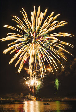 Fireworks exploding over water, Bainbridge Island, Washington, USA