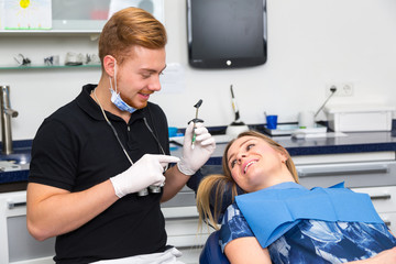 Dentist giving a patient anesthetization injection in dental clinic