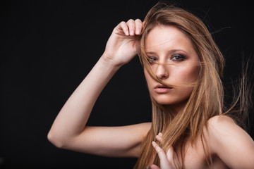 Fototapeta premium Young woman with fresh skin looking at camera