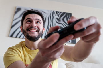 Bearded gamer with controller