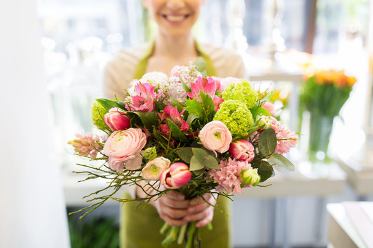close up of woman holding bunch at flower shop