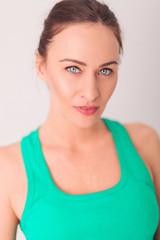 fresh young woman in green undershirt