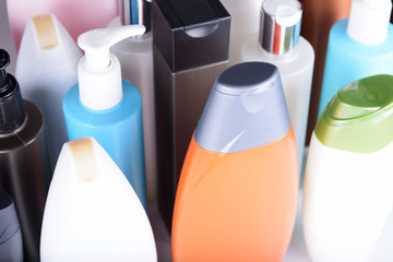 Lots of plastic bottles of shampoo