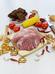 fresh pork steak on wooden Board