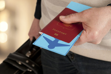 Passport and ticket in hand in airport