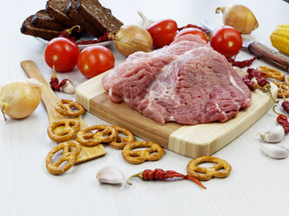 fresh pork steak on wooden Board