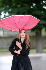 Young girl with red umbrella