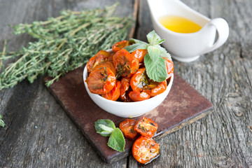 Tomatoes dried with herbs in olive oil 