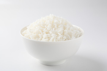 Rice in a bowl on a white background