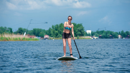 SUP Stand up paddle board woman paddle boarding01