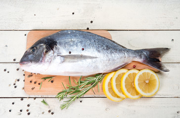 Fresh crude fish with a lemon for preparation 