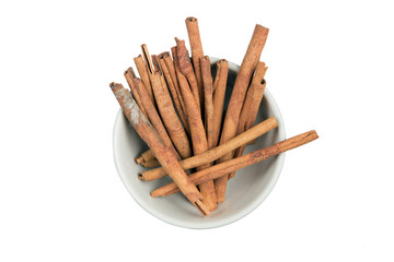 Isolated a bowl of cinnamon stick on a white background