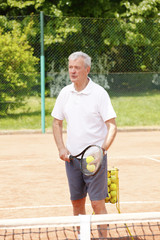 Senior tennis player portrait