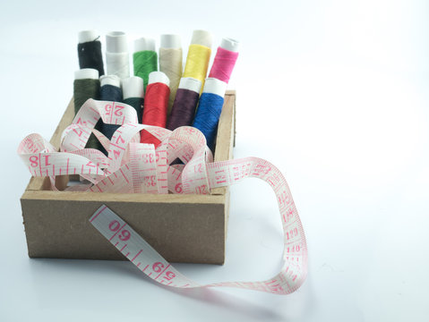 neddle and yarn in box onwhite background isolate