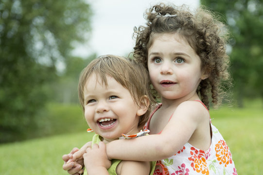 Portrait of two toddlers, playing