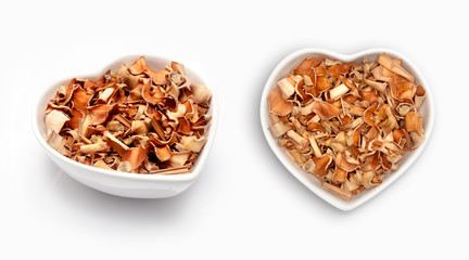 dried lemongrass   in a heart shaped bowl, isolated on white