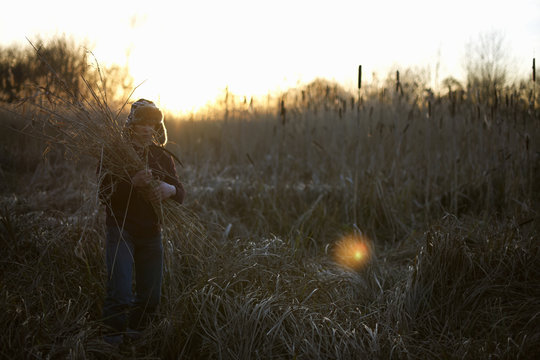 Mature man gathering crops
