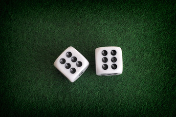Two dices on a green background