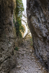 The passage between the rocks  in the canyon crevice. Path to the light in the end