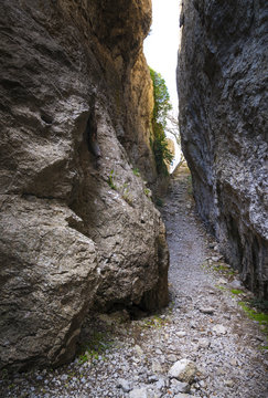 The passage between the rocks  in the canyon crevice. Path to the light in the end