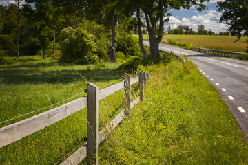 Fototapeta premium Countryside road fence
