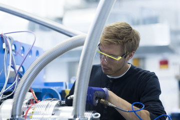 Factory technician testing network cables
