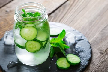 Wandaufkleber Refreshing water with cucumber and mint © Ruslan Mitin