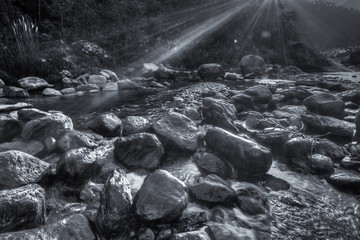 River water flowing through rocks at dawn, Reshi River, Sikkim, India