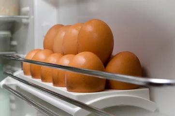 Foto auf Acrylglas eggs in refrigerator / brown eggs in a tray in the refrigerator © kipp74