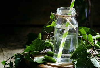 Traditional Russian refreshing drink birch juice in a small bott