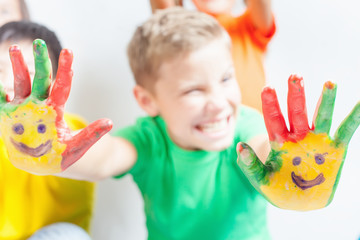 Group of international kids holding globe earth