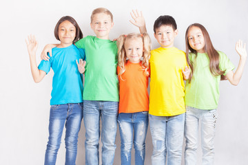 Group of international kids holding globe earth