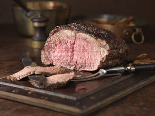 Christmas dinner. 28 day matured sirloin of beef served rare medium with roasted parsnips