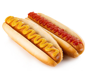 Classic hot dogs with mustard and ketchup close-up on a white background. Fast food.