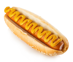 Hot dog with mustard close-up isolated on a white background.